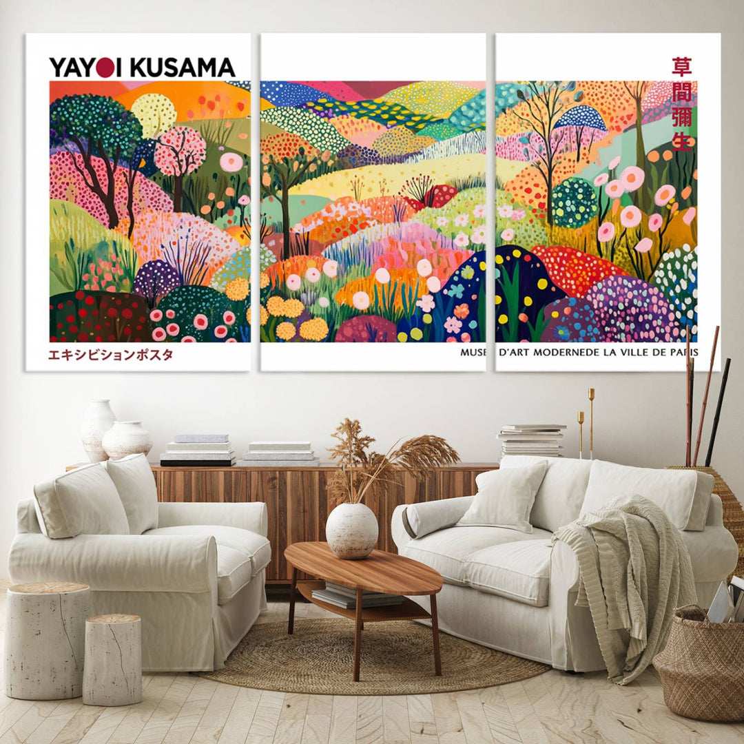 Three vibrant, abstract Yayoi Kusama wall art prints adorn a black wall, creating a perfect blend of contemporary décor.