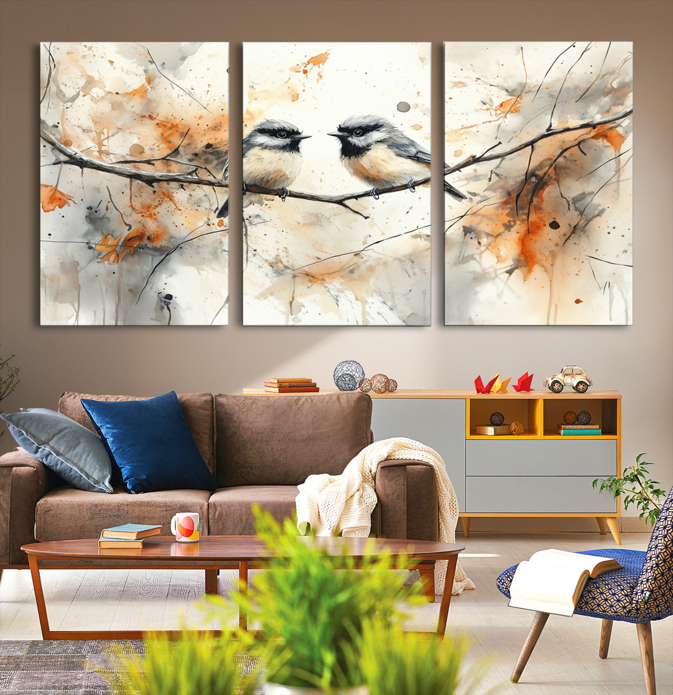 A soft and elegant watercolor painting of two chickadees perched on a delicate branch, surrounded by splashes of orange and neutral tones evoking a calm autumn day.