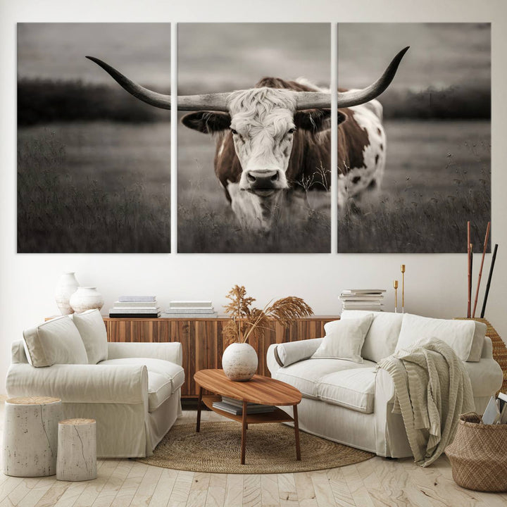 The Texas Longhorn Cow Canvas Wall Art Print adds a rustic touch to a living room.