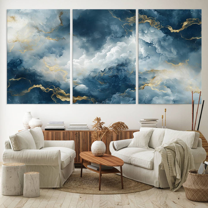 Modern living room featuring the Large Abstract Print - Luxe Blue and Gold Abstract Canvas Wall Art that showcases a bold cloudscape, perfect for modern home decor.