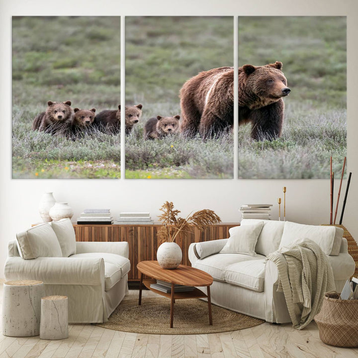 The large canvas print titled "Queen of the Tetons, 399 Grizzly Bear Cubs" showcases majestic wildlife photography of a bear and her cubs walking through the grass. This stunning canvas wall art, handmade in the USA, adds a charming touch to any room with its rustic decor appeal.