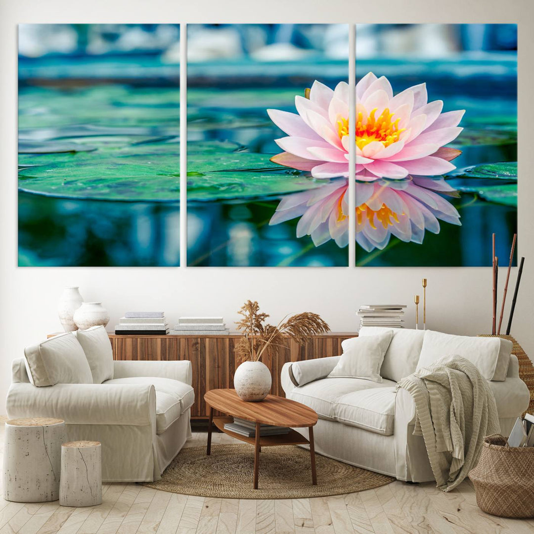 The Lotus Flower Canvas Print showcases a pink water lily with a yellow center gracefully floating on a calm pond.