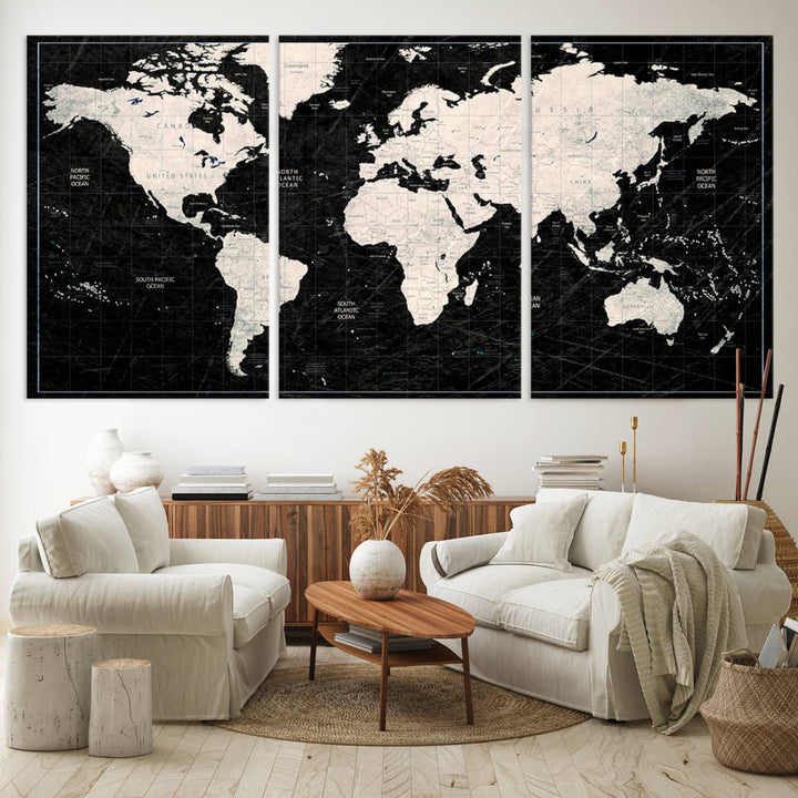 A bold global style framed black and white world map canvas print, presented in three panels, perfect for modern home or office decor.
