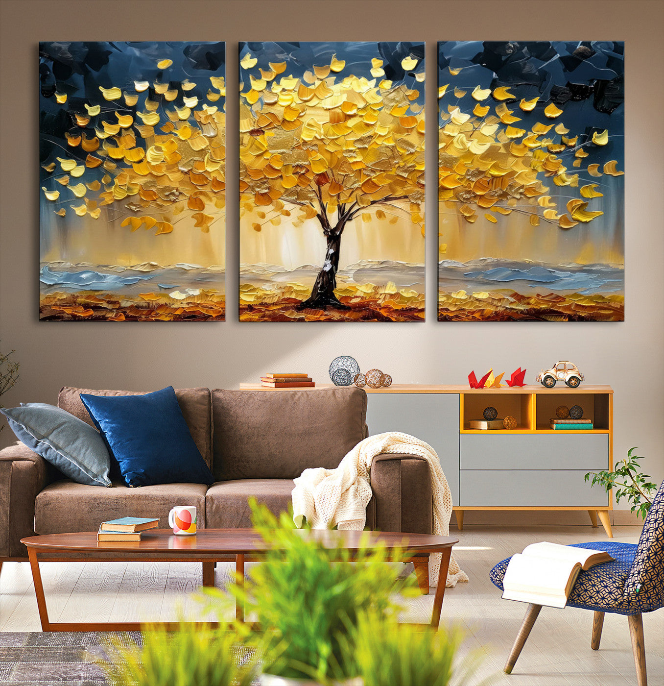 Canvas of a golden autumn tree with textured brushstrokes and moody blue skies, perfect for dramatic and vibrant home decor.