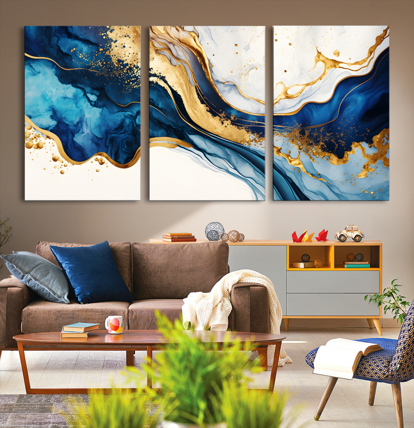 Canvas artwork with fluid blue and gold marbling, perfect for modern luxe or elegant abstract home decor styles.
