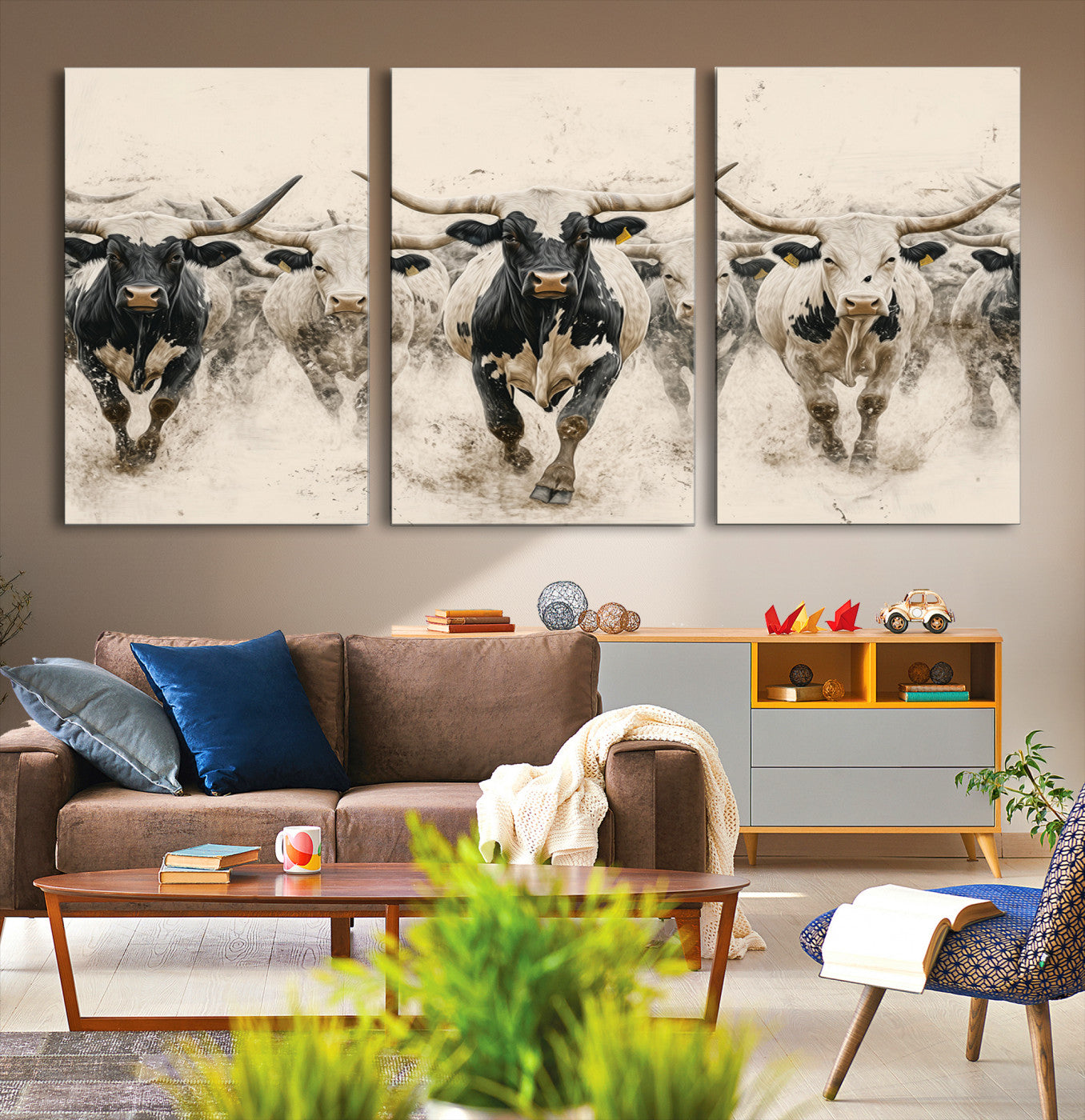Canvas artwork of Texas Longhorn bulls walking in a dusty herd, ideal for rustic Western or country-style interior decor.
