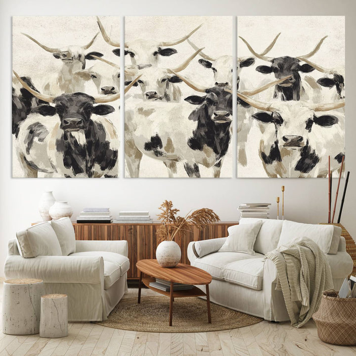 Canvas print titled Longhorn Texas Cow Drawing, depicting longhorn cattle with black and white markings, made in the USA, displayed on the wall.