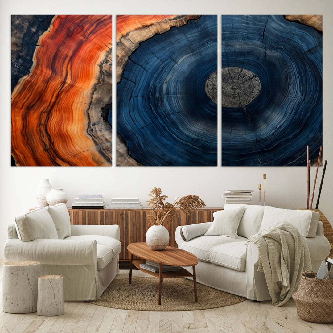 Abstract Tree Ring Wall Art Print on canvas featuring vibrant blue, orange, and brown rings with a natural rustic wood texture. Free shipping available!.