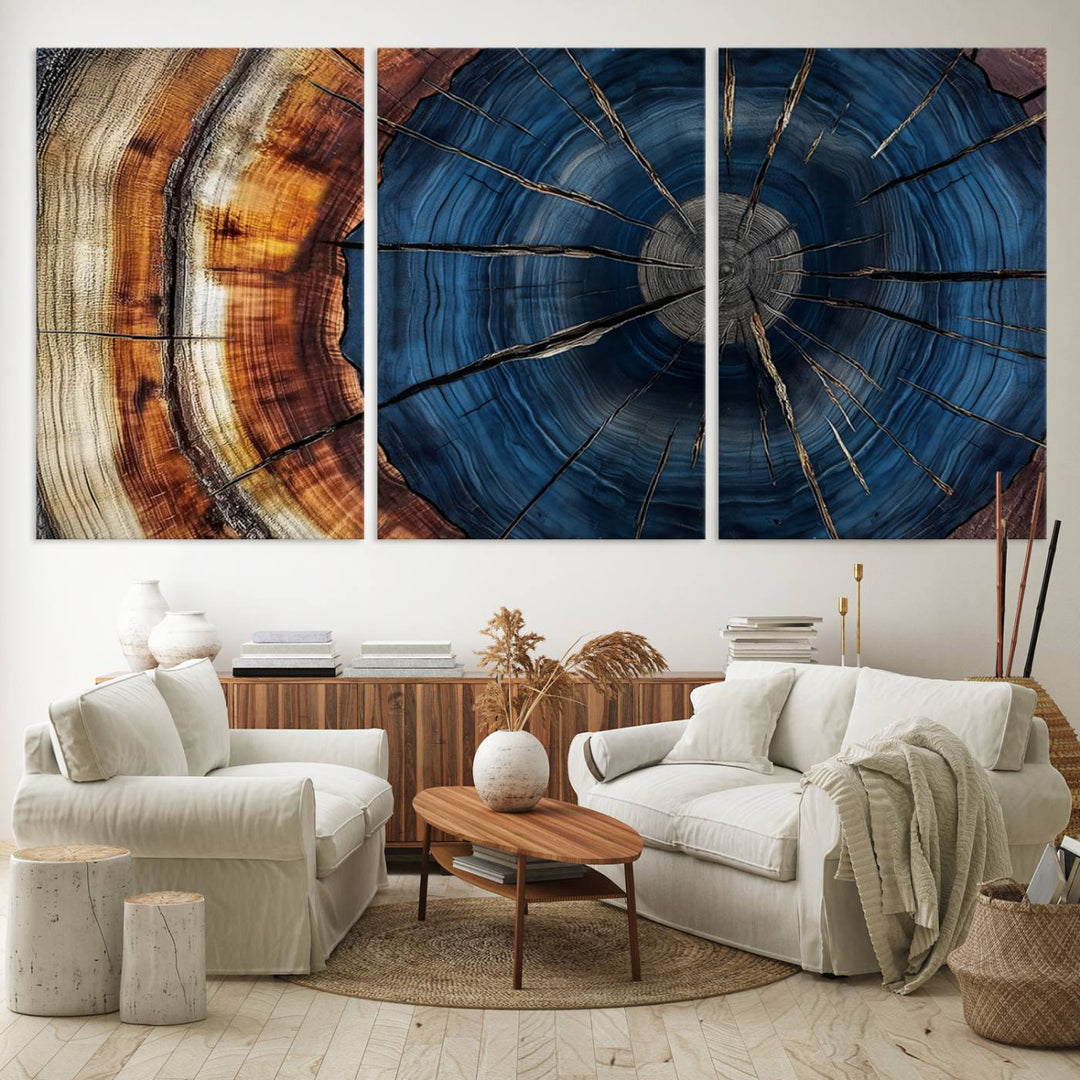 The Abstract Tree Rings Canvas Print features blue, brown, and orange rings that highlight wood grain and natures beauty.