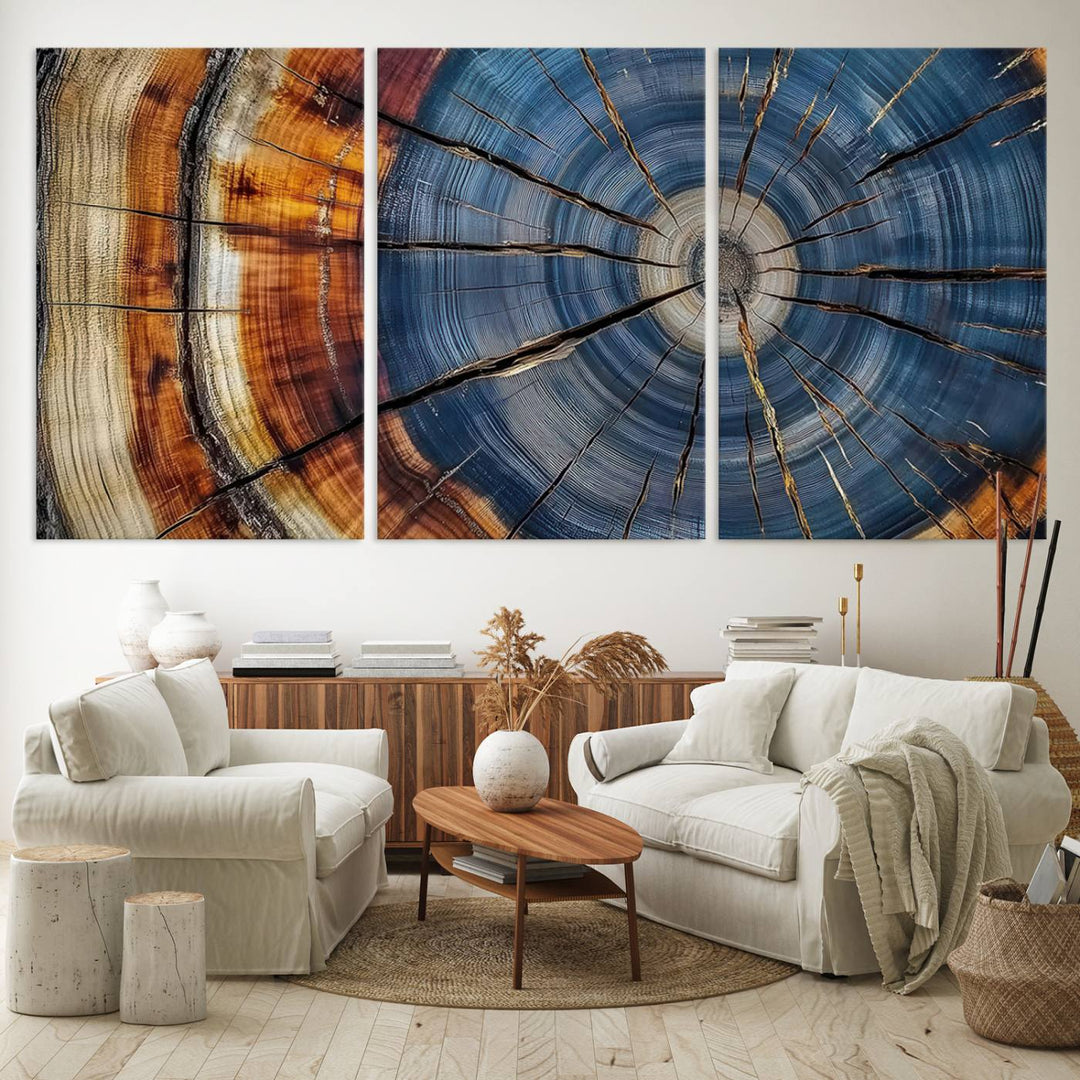 Close-up of blue, brown, and orange wood grain rings on the Abstract Tree Rings Canvas Wall Art Print.