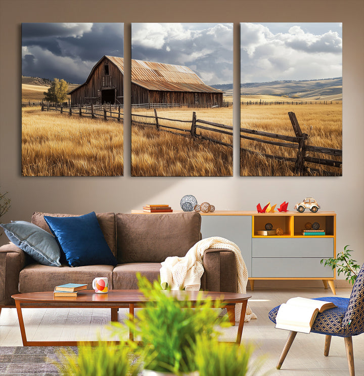 Canvas of a weathered wooden barn in a golden field under a dramatic sky, perfect for rustic or farmhouse-style wall decor.