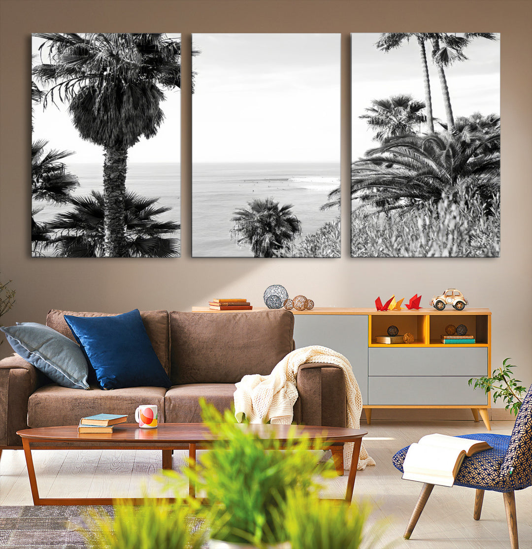 Monochrome canvas of palm trees framing a coastal surf scene, perfect for California-inspired or retro black-and-white beach decor.