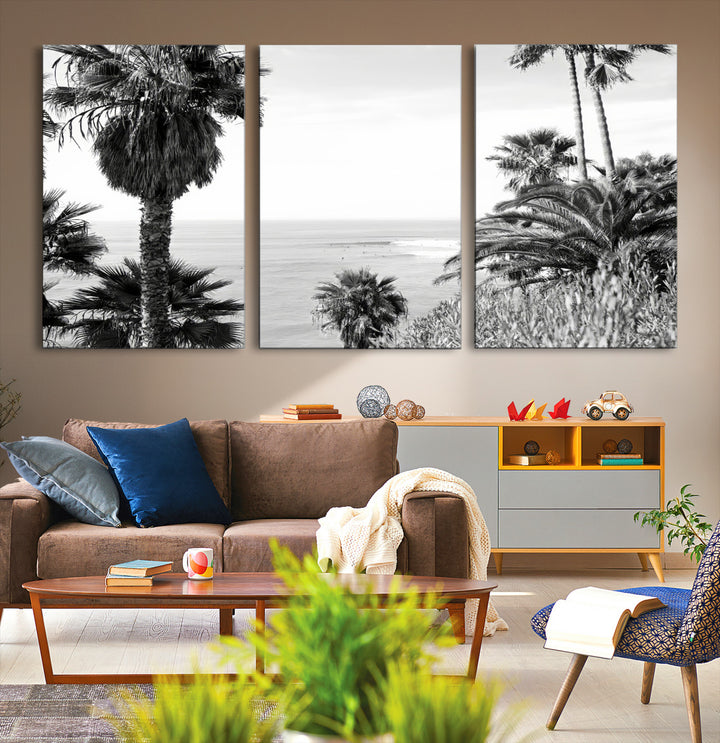 Monochrome canvas of palm trees framing a coastal surf scene, perfect for California-inspired or retro black-and-white beach decor.