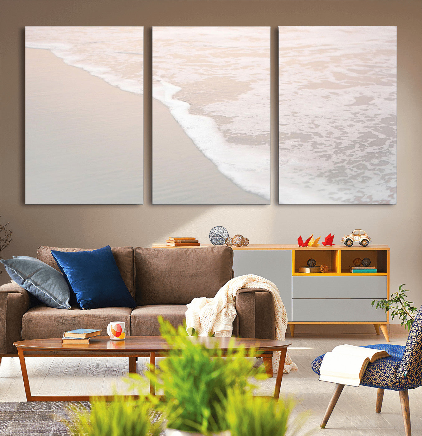 Close-up view of gentle ocean waves washing over smooth, wet sandy beach with soft foam along the shoreline.