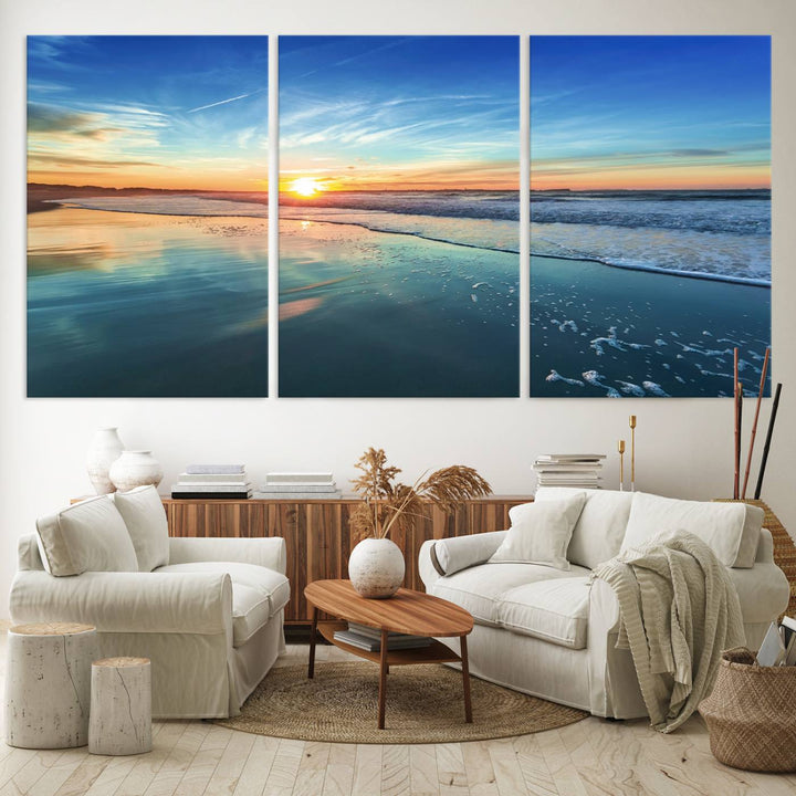 The Blue Sky and Beach Wall Art Canvas Print features a vibrant orange sky reflecting on wet sand.