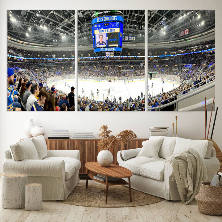 Wall art prints depicting the bustling scenes of the St. Louis Blues being cheered on by a full house at the Enterprise Center, beneath a large scoreboard.