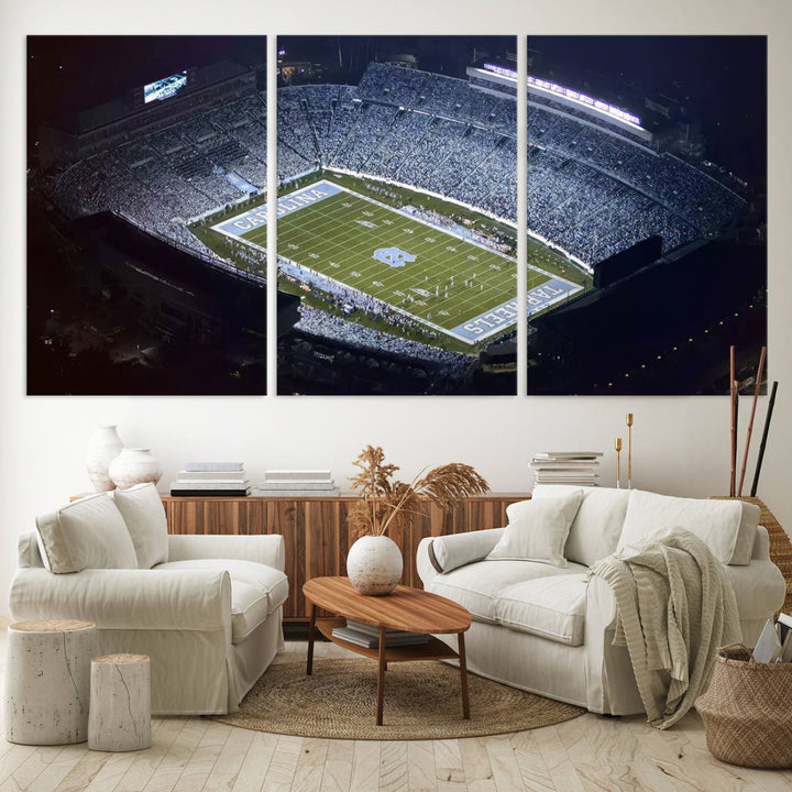 A University of North Carolina Tar Heels Football Team Print, showcasing Chapel Hill's Kenan Memorial Stadium, hangs in a modern dining room, adding a gallery-quality finish that enhances the entire space.