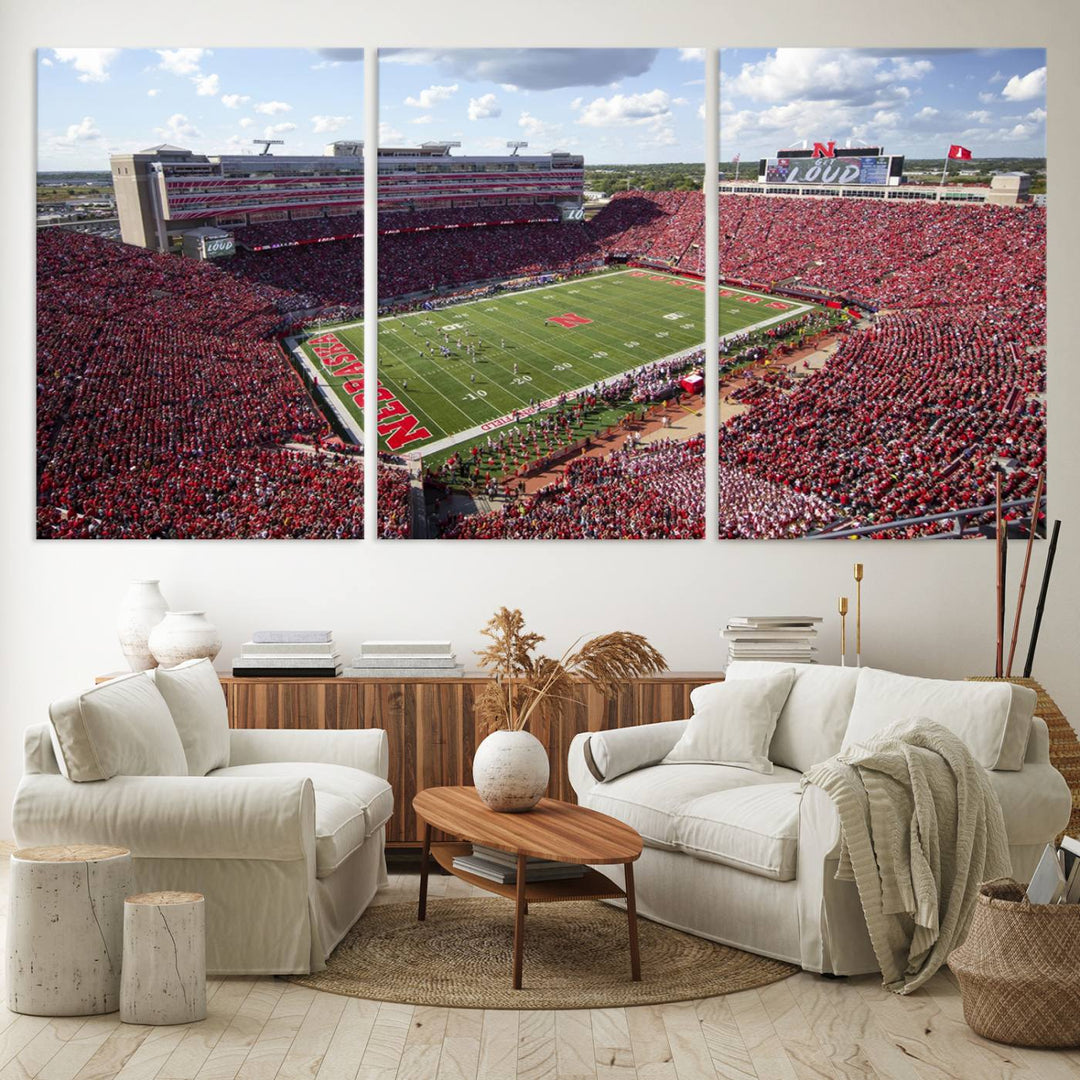 The University of Nebraska Cornhuskers Football Team Print showcases a vibrant triptych of Lincoln Memorial Stadium, depicting a packed football stadium filled with energetic fans. This handmade art piece is crafted in the USA and printed on premium canvas for a gallery-quality finish.