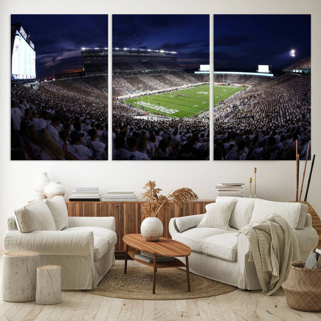 A packed football stadium at night, with bright lights and fans in white, depicted in a Michigan State Spartans Stadium wall art.