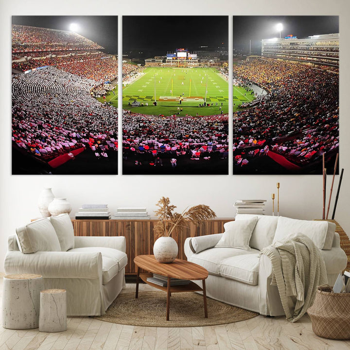 The Maryland Terrapins Football Wall Art Canvas showcases a packed SECU Stadium at night with a bright field and cheering fans.