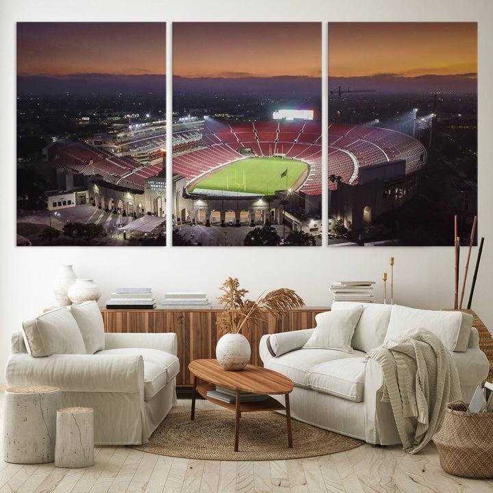 The USC Trojans Stadium canvas captures Memorial Coliseum at twilight, showcasing red seats and a green field beneath an orange sky.