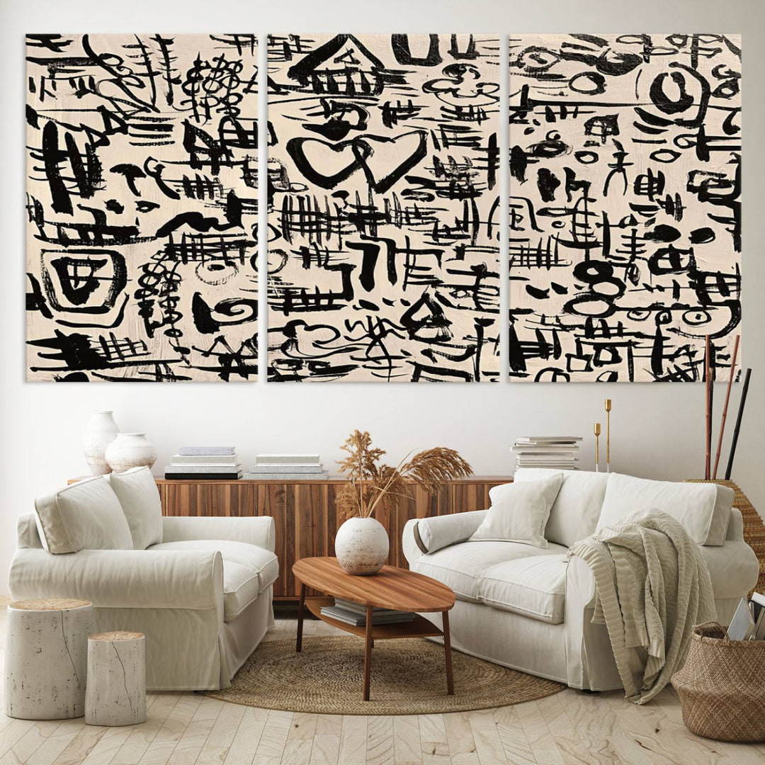 The Abstract Love and Chaos canvas is a museum-quality print featuring black symbols on a beige background, adorned with a heart and scribble design. It is framed to enhance its artistic appeal.