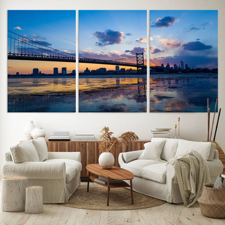 A photograph titled "Large Wall Art Philadelphia Canvas Print - Benjamin Franklin Bridge at Sunset" displays a breathtaking cityscape of the bridge reflected in the water. This image features a gallery-quality finish that promises to transform any space into an evocative memory.