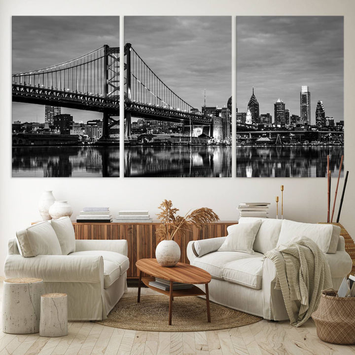 The "Large Wall Art Philadelphia Canvas Print" showcases a black-and-white depiction of the Ben Franklin Bridge with a water reflection.