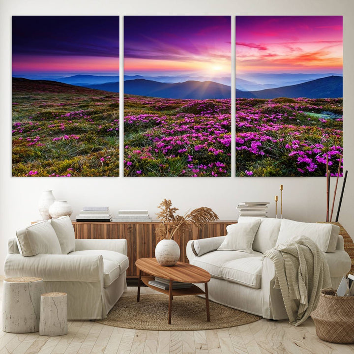 A 3-panel landscape photography canvas of a sunset over mountain meadows with purple wildflowers decorates the wall.