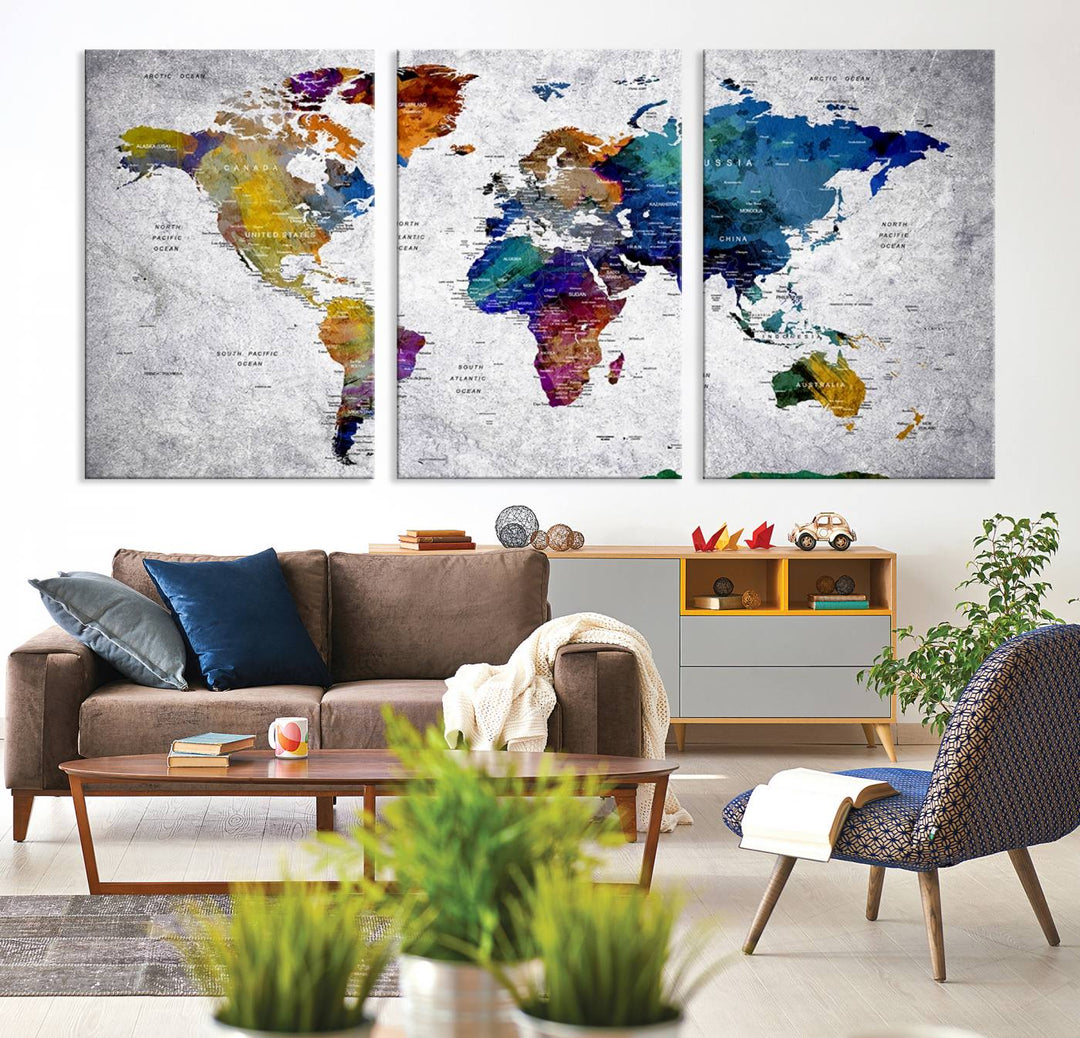 The World Map Art Canvas Print, featuring country names on a grunge-stained gray background, is perfect for stylish home decor.