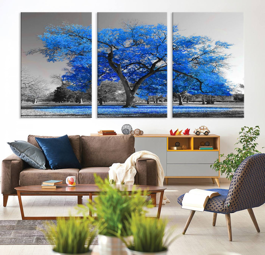 The dining area features the Vibrant Blue Tree Canvas Art amidst a grayscale landscape.