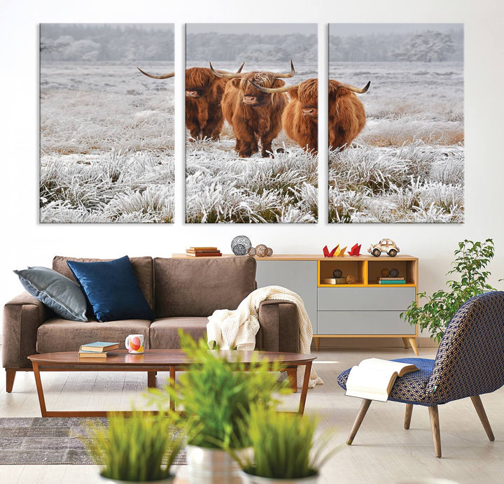 The Highland Cows in Snow canvas showcases three cattle in a frosty field.