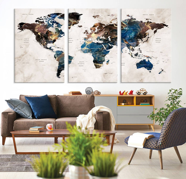 Abstract earth-toned 3-panel world map wall art featuring blues and browns, ready to hang; it showcases continents on modern canvas.