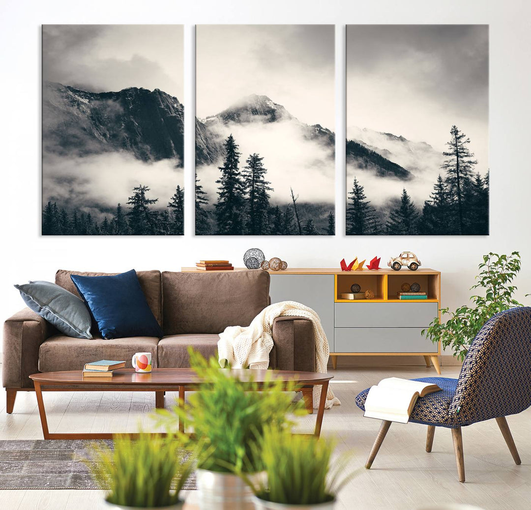 A large foggy mountain forest canvas print hangs prominently in the room.