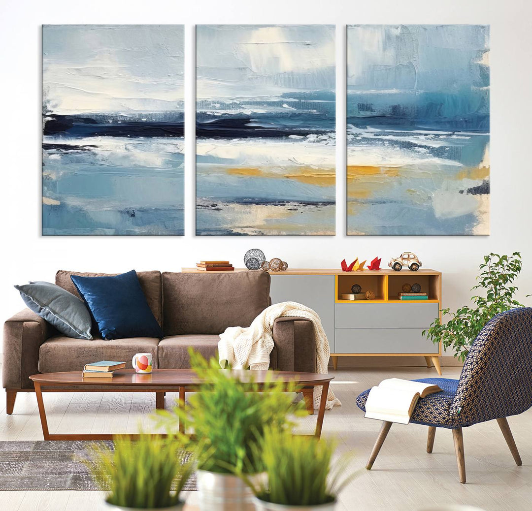 The Abstract Ocean Canvas Wall Art in coastal blue and gold enhances the modern kitchen.