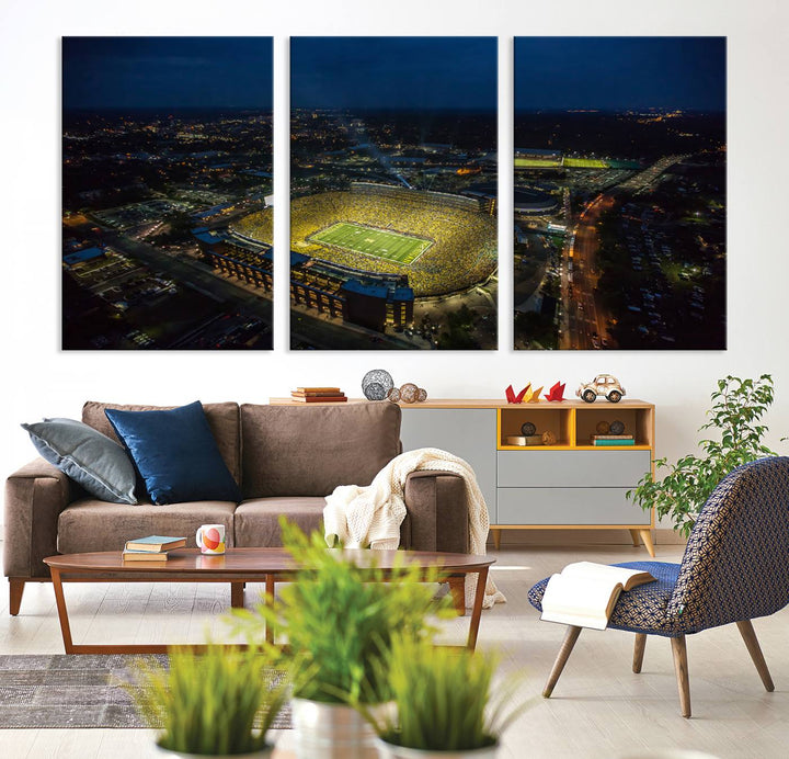 Aerial view of Michigan Stadium at night, surrounded by city lights, depicted on a Michigan Wolverines wall art canvas print.