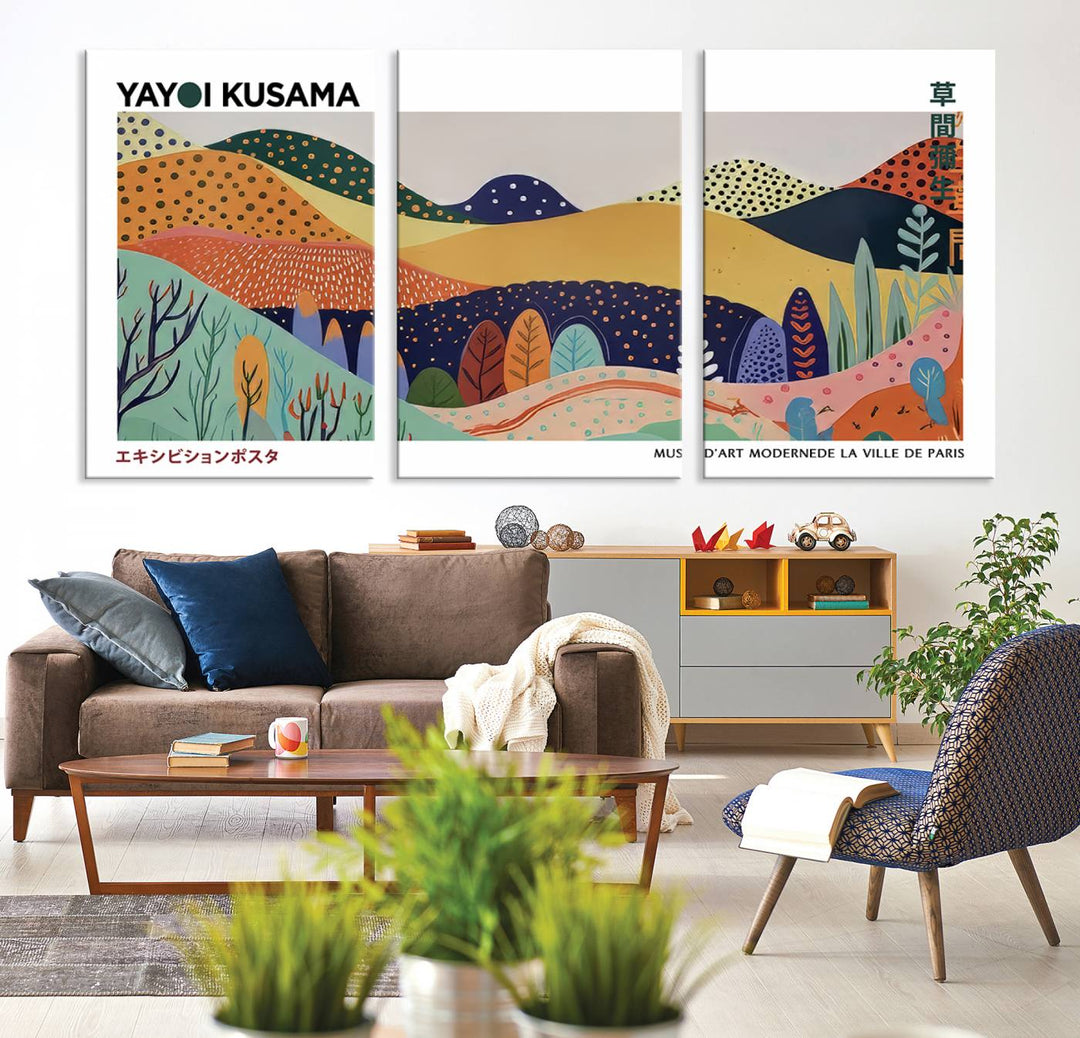 A triptych featuring the Framed Yayoi Kusama 1986 Wall Art Print hangs above. This Japanese Wabi Sabi inspired piece, rich in vibrant abstract landscapes, adds an elegant touch to any nature-inspired décor.