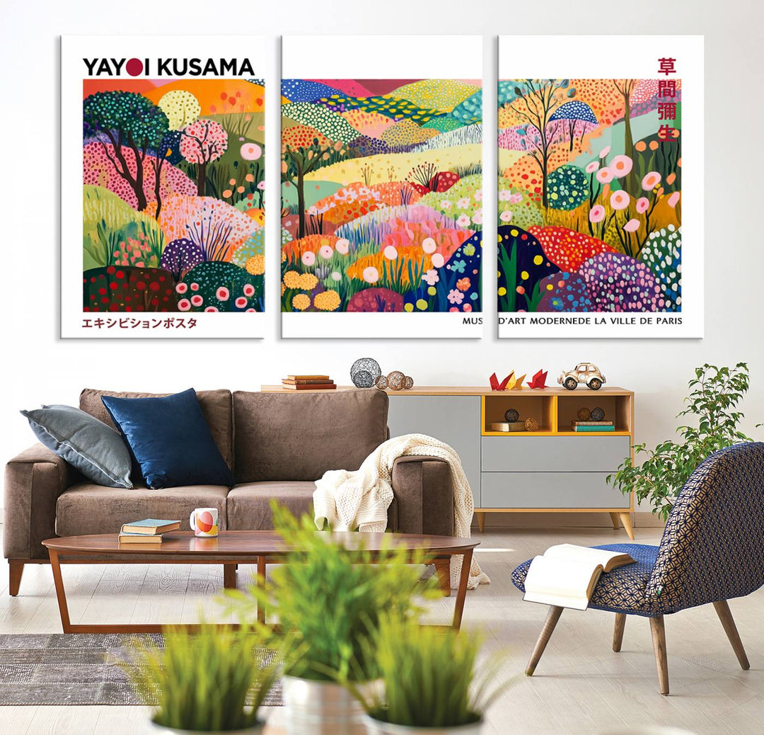 Three vibrant, abstract Yayoi Kusama wall art prints adorn a black wall, creating a perfect blend of contemporary décor.