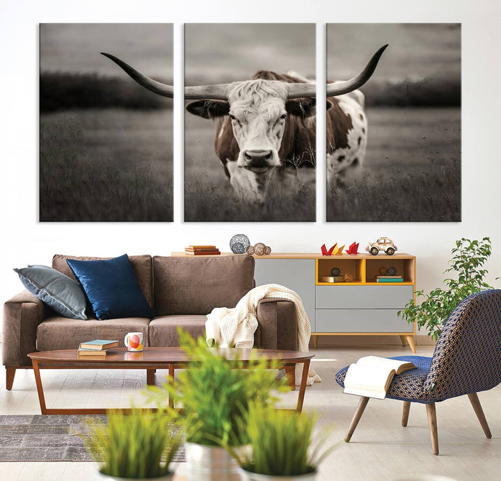 The Texas Longhorn Cow Canvas Wall Art Print adds a rustic touch to a living room.