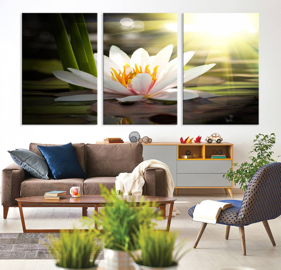 The Lotus Flower Wall Art Canvas Print showcases a white water lily with a yellow center floating gracefully in sunlight.