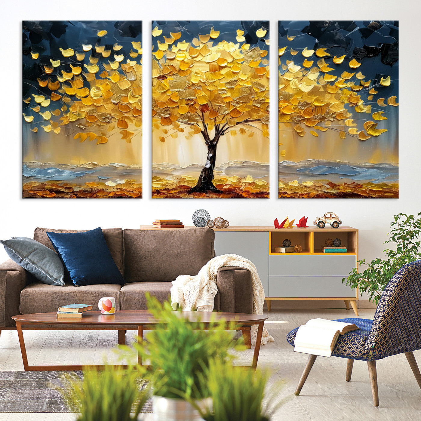 Canvas of a golden autumn tree with textured brushstrokes and moody blue skies, perfect for dramatic and vibrant home decor.
