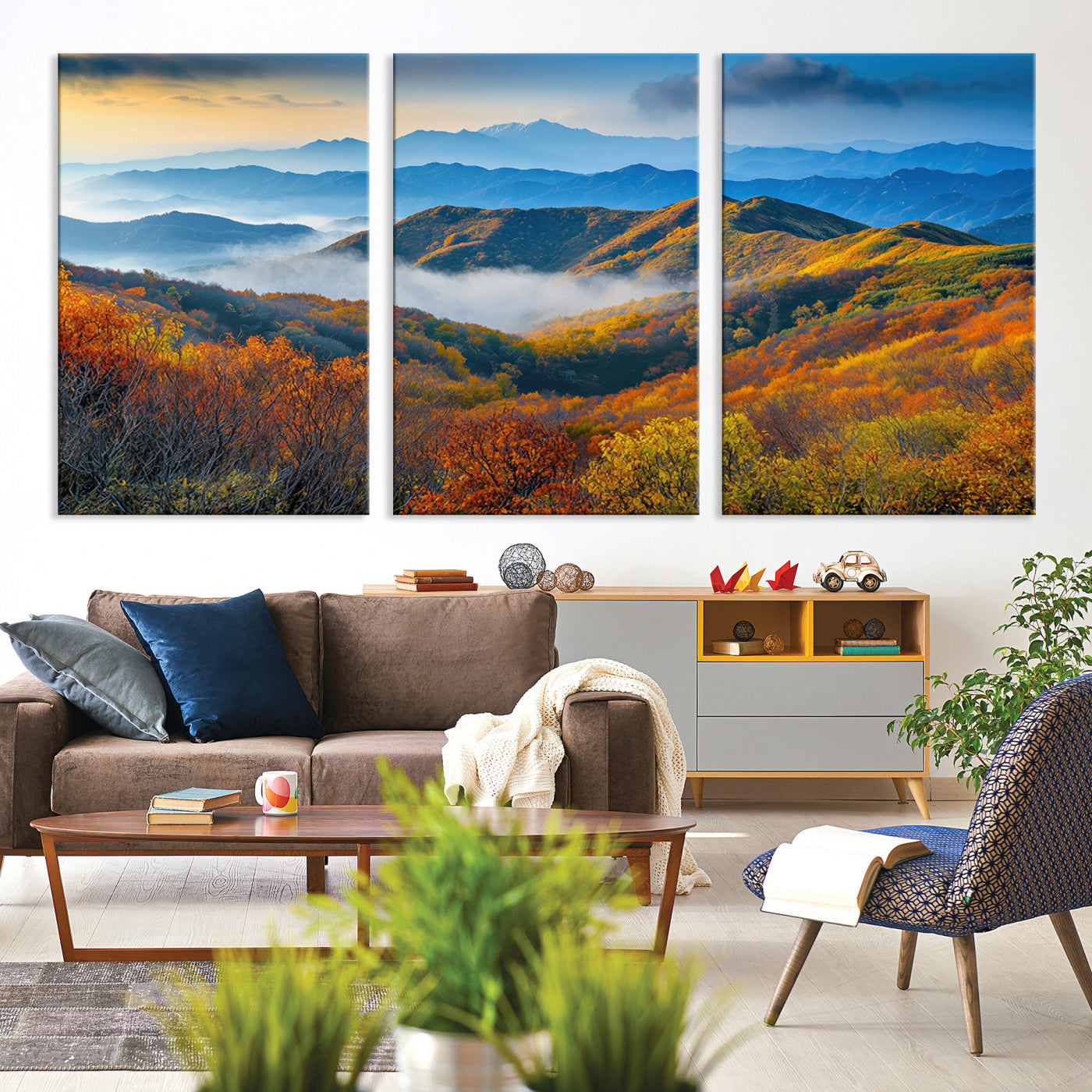Vibrant canvas of autumn mountains with colorful trees, layered blue ridges, and soft morning fog, ideal for bright nature-themed decor.