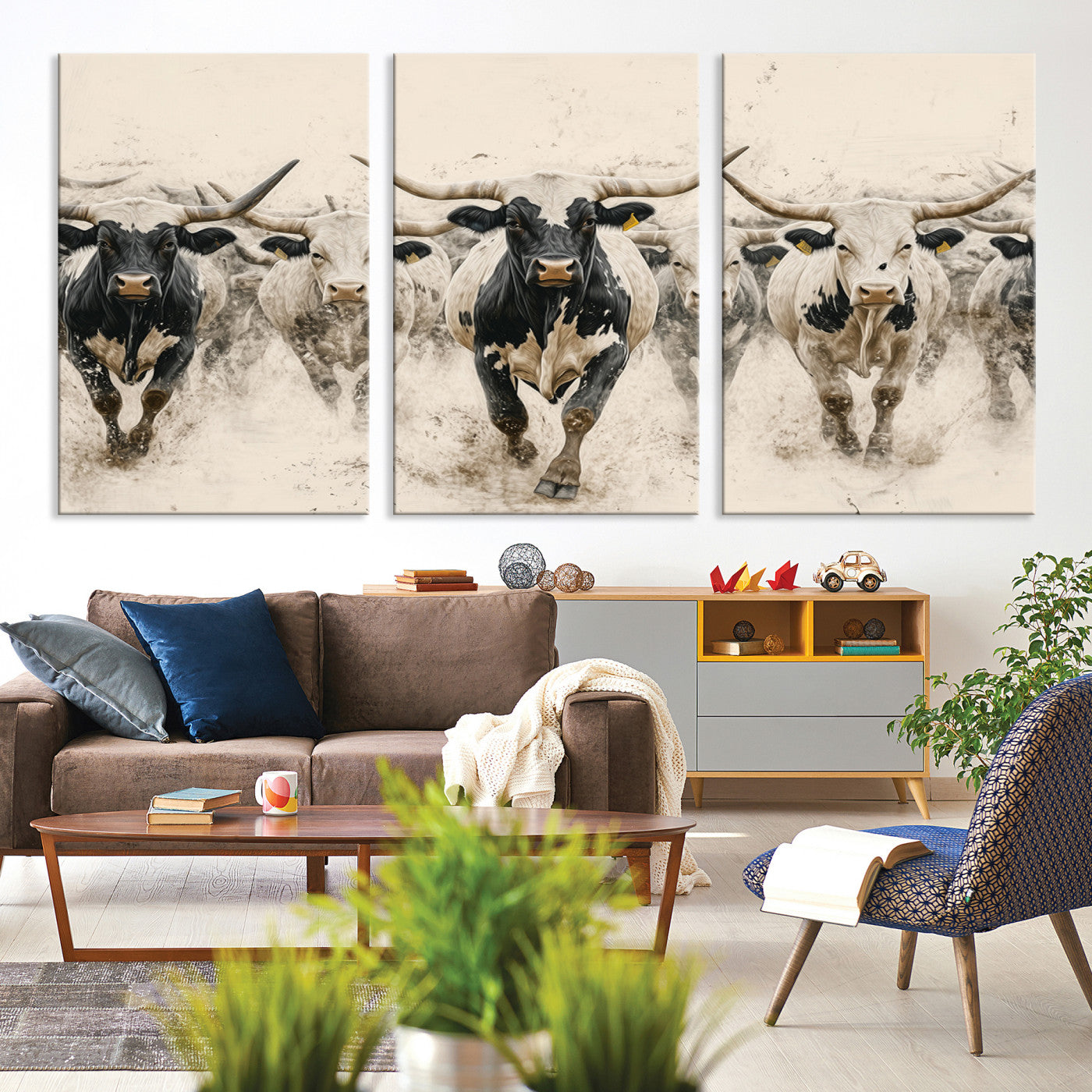 Canvas artwork of Texas Longhorn bulls walking in a dusty herd, ideal for rustic Western or country-style interior decor.