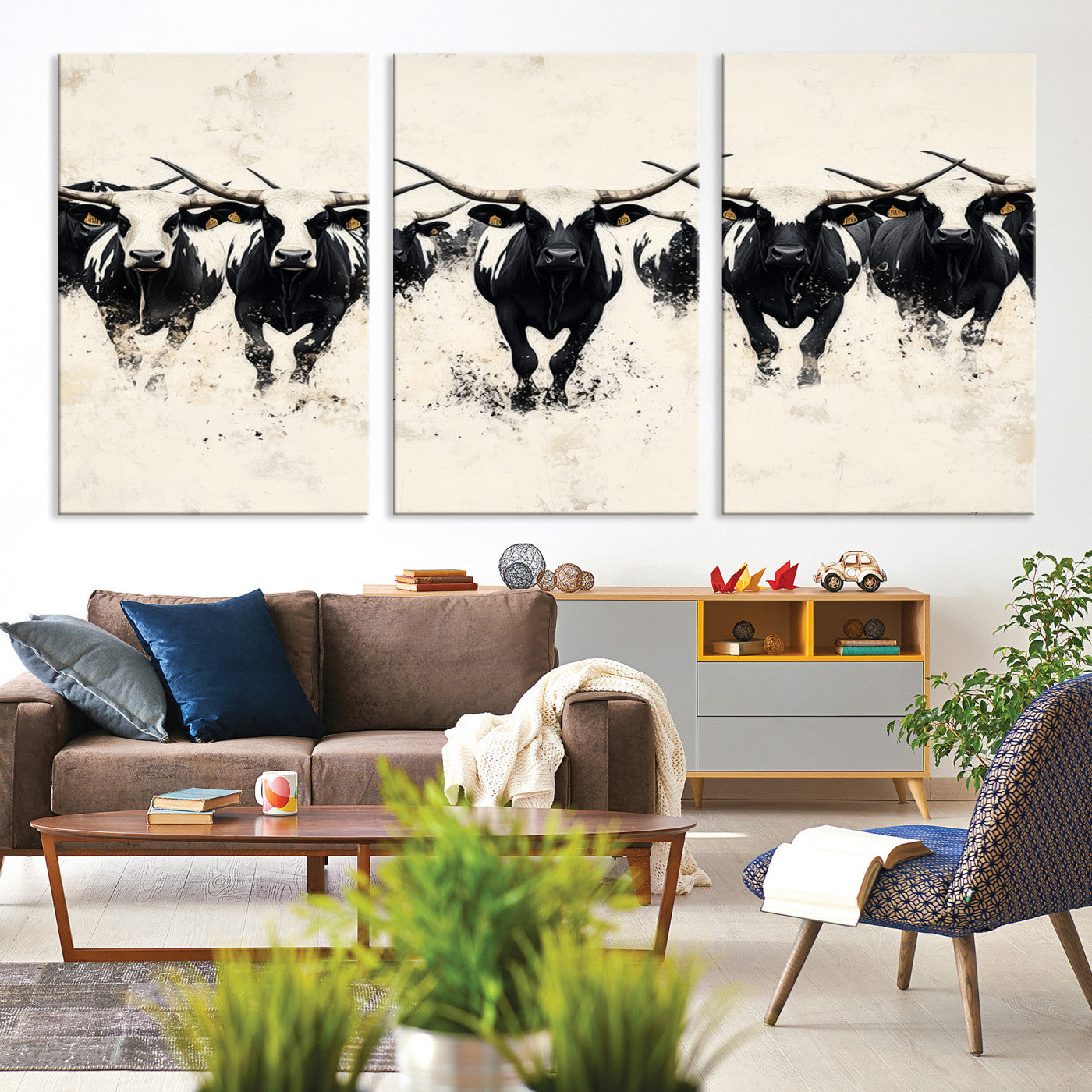 Canvas artwork of black and white Texas longhorns in a bold stampede over a minimalist background, ideal for rustic modern or Western-themed decor.