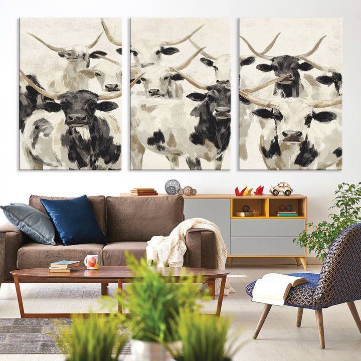 Canvas print titled Longhorn Texas Cow Drawing, depicting longhorn cattle with black and white markings, made in the USA, displayed on the wall.