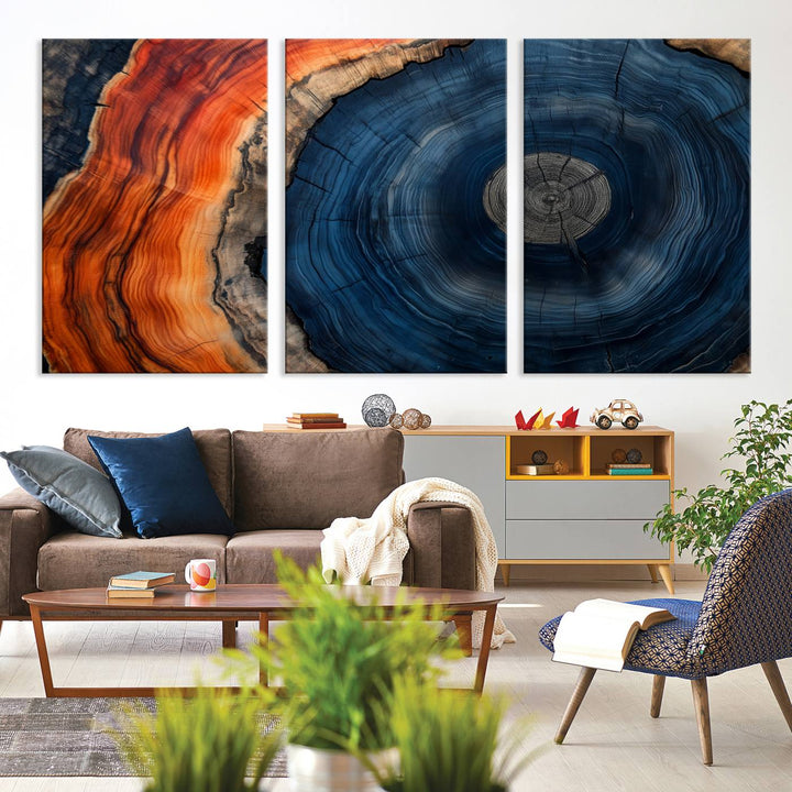 Abstract Tree Ring Wall Art Print on canvas featuring vibrant blue, orange, and brown rings with a natural rustic wood texture. Free shipping available!.