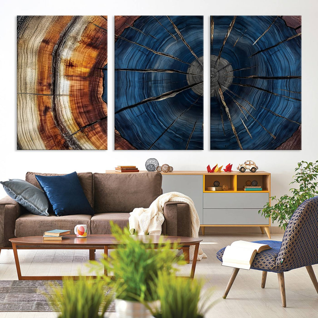 The Abstract Tree Rings Canvas Print features blue, brown, and orange rings that highlight wood grain and natures beauty.