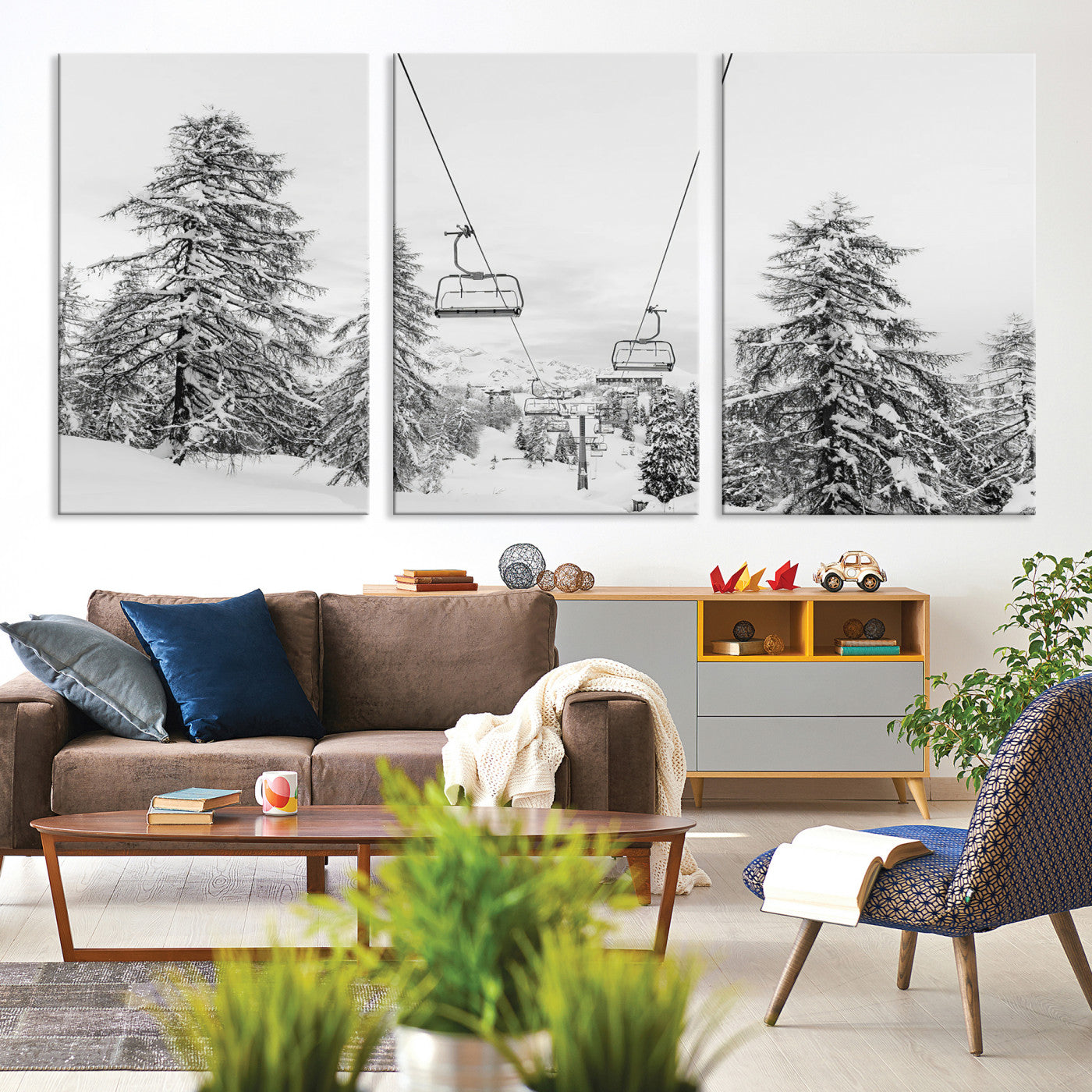 Black and white image of a ski lift amidst snow-covered pine trees, ideal for winter mountain or cabin-themed decor.