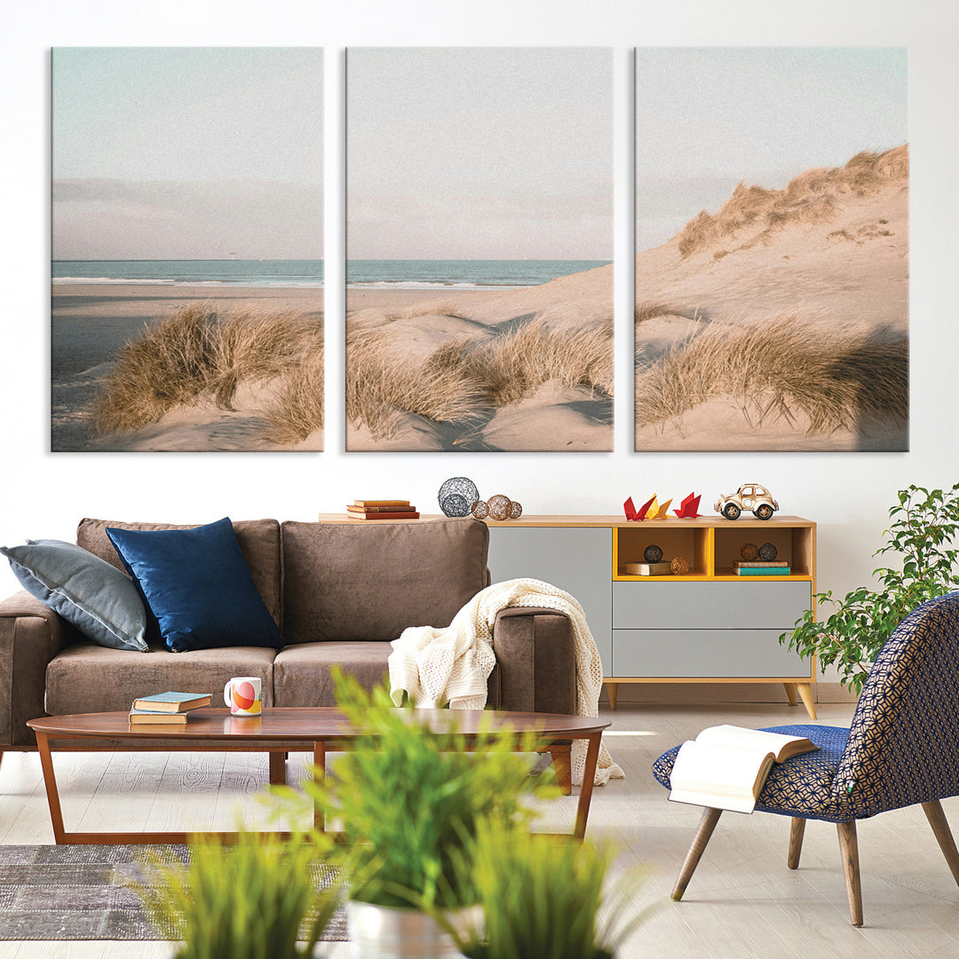 Soft pastel-toned beach scene with sand dunes, windswept grasses, and a calm ocean horizon, creating a serene coastal atmosphere.