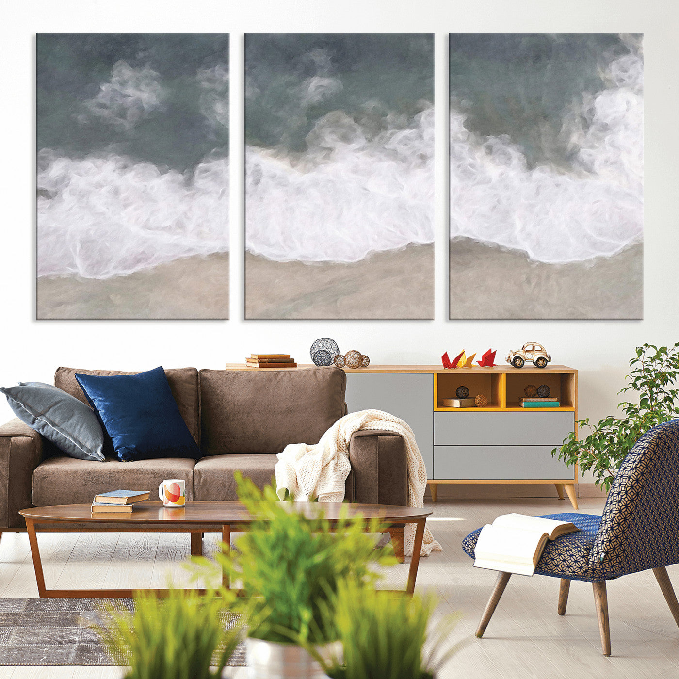 Wall art canvas print featuring foamy ocean waves softly rolling onto a sandy shore with a dreamy, painterly texture.